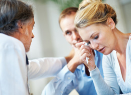 doctor with upset woman