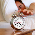 man with alarm clock