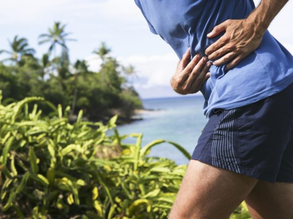 Side stitch- pain in the side of a jogger`s torso. The pain is probably due to a cramp of the diaphragm-muscle. XXL size image.