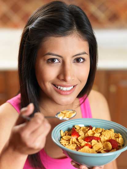 Woman eating breakfast