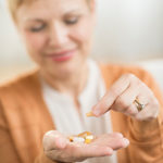 woman taking supplements