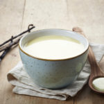 bowl of homemade vanilla sauce on wooden table