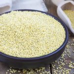 Organic millet groats in a ceramic bowl, concept for healthy eating