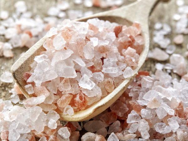 pink himalayan salt on wooden table