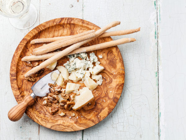 Parmesan cheese and Dorblu on olive wood plate and Grissini  bread sticks