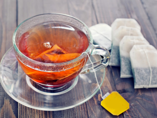 tea in glass cup on the wooden table