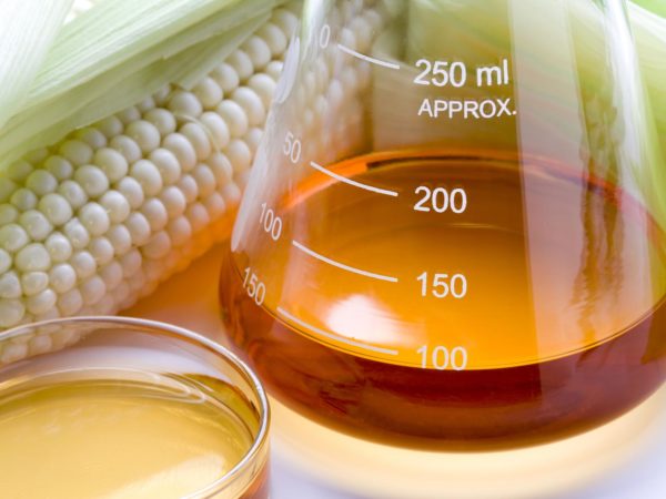 Corn and lab equipment. Concept for biofuel research.