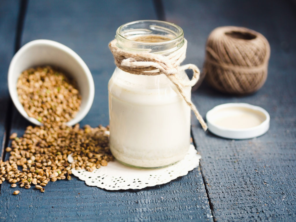 vegan fresh milk from hemp seeds in a glass jar, clean eating, non-dairy milk