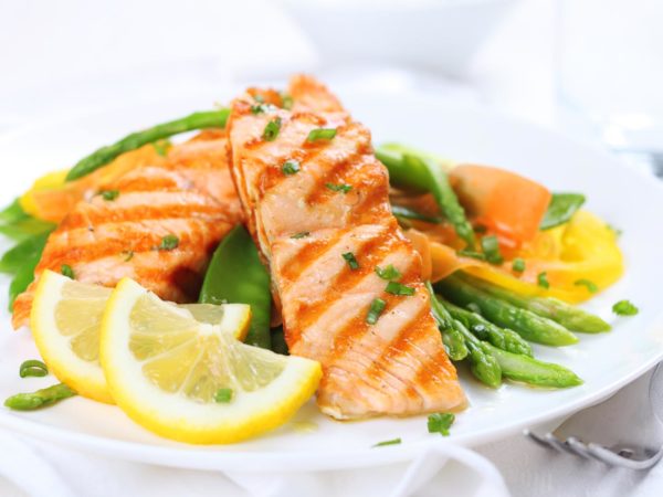 fried salmon on a plate close up