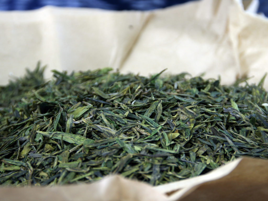"Longjing tea is produced on the outskirts of town at Longjing or Dragon Well. It is among the only remaining places where tea is still baked by hand and is said to produce one of the finest green teas in all of China, earning a spot in the China Famous Tea list."