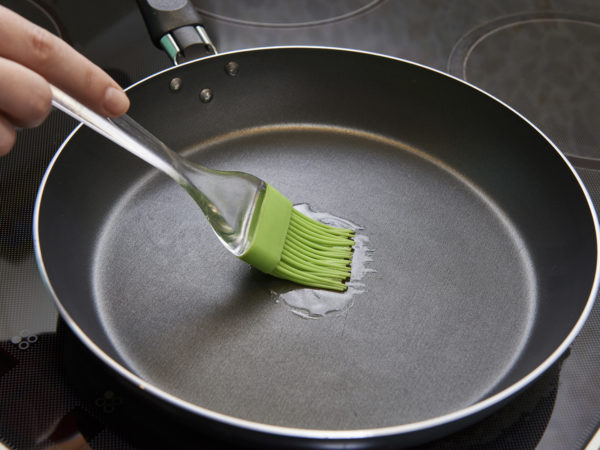 Brush with sunflower oil in a frying pan