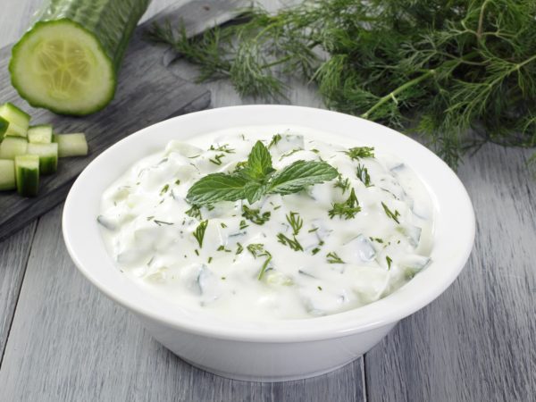 tzatziki cucumber with yogurt on gray background