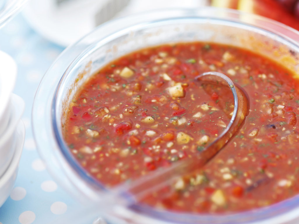 "Tomato vegetable soup, traditionally served cold. Very soft focus."