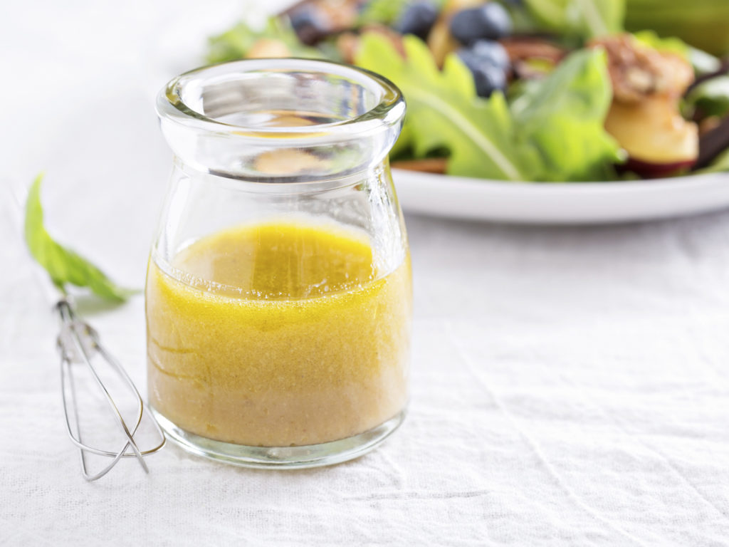 Salad dressing with olive oil, honey, mustard and vinegar