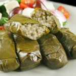 Greek dolmades wrapped with vine leaves and rice with salad.