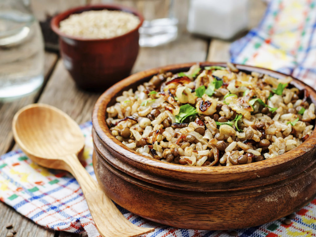 Lentils and rice with Crispy Onions and Parsley. Mujadara. toning. selective focus