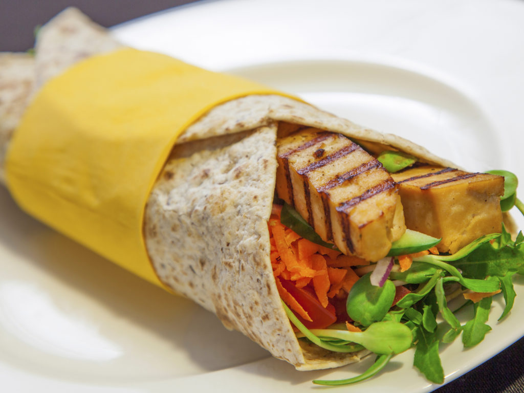 Marinated tofu wrap with raw vegetables