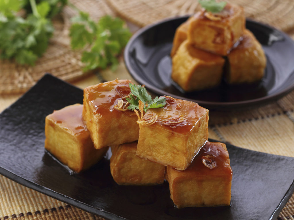 Sweet and sour tofu on dish vegetarian food.