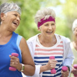 Shot of a group of elderly friends enjoying a workout together outdoors