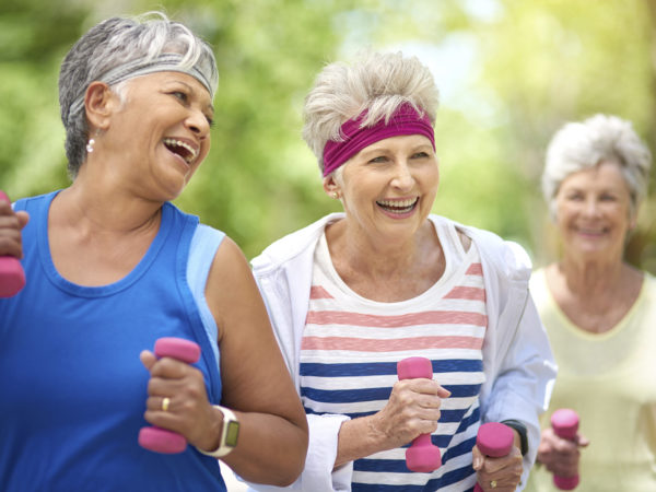 Shot of a group of elderly friends enjoying a workout together outdoors