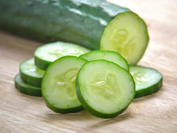 Fresh Cucumber  slices on wood background