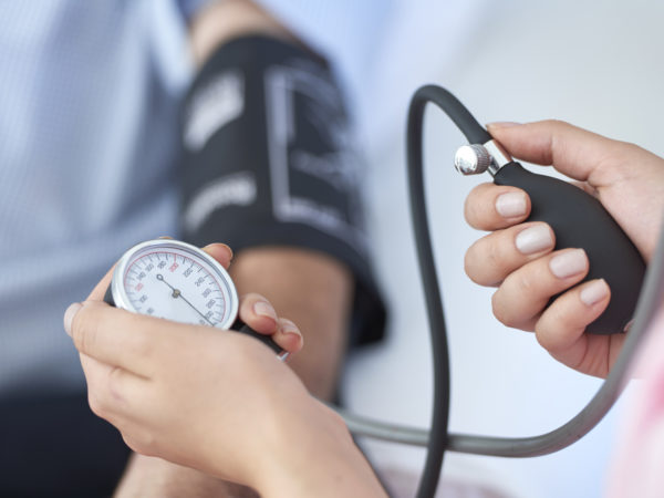 Nurse measuring blood pressure.