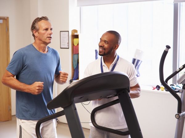 Patient Using Treadmill In Hospital Physiotherapy Department