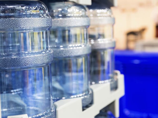 Three large bottles for fresh water close up