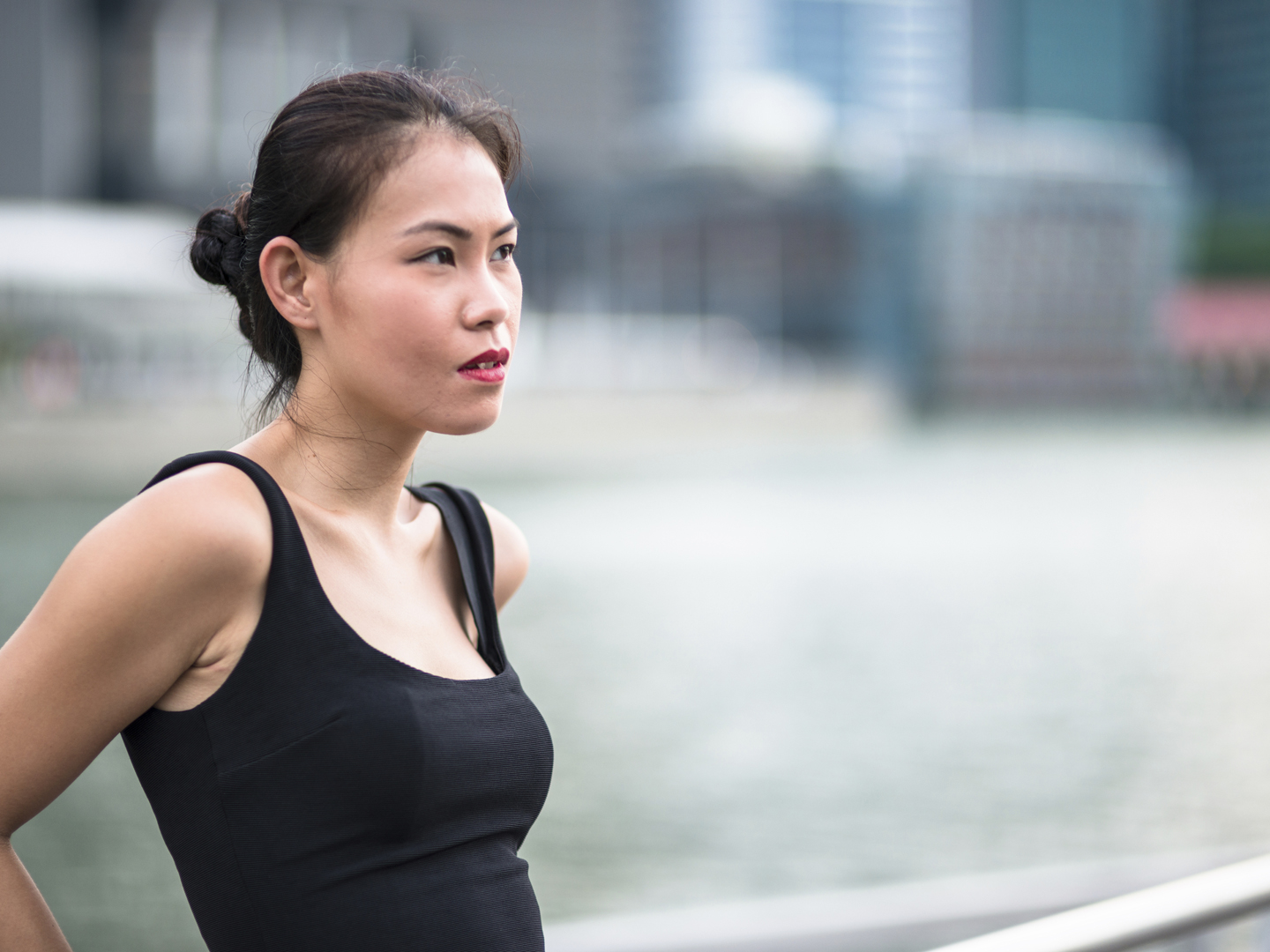 pretty asian woman standing outdoors