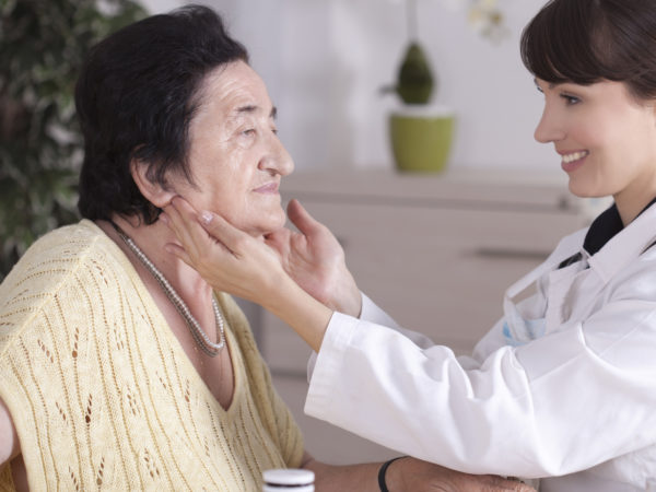 Older women in the medical examination at doctor's office .