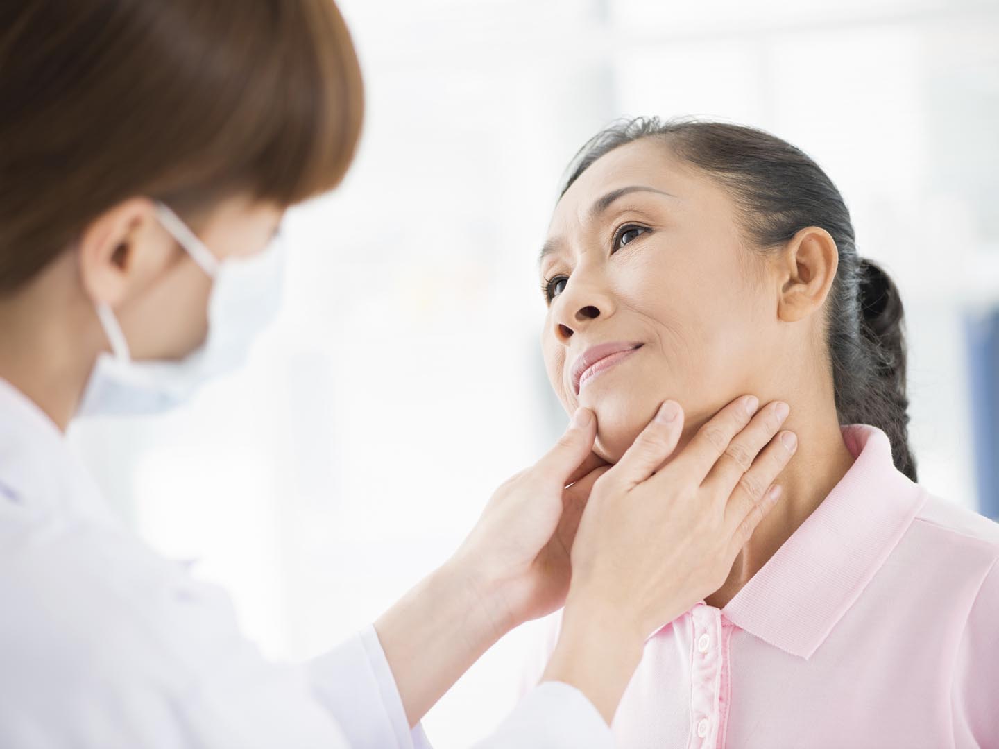 Image of a senior patient having endocrinologists check-up on the foreground