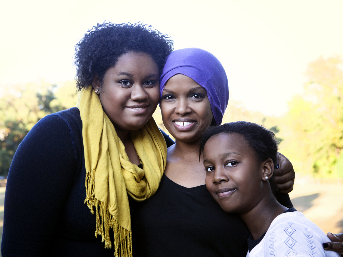 Beautiful african american woman with cancer and her daughters