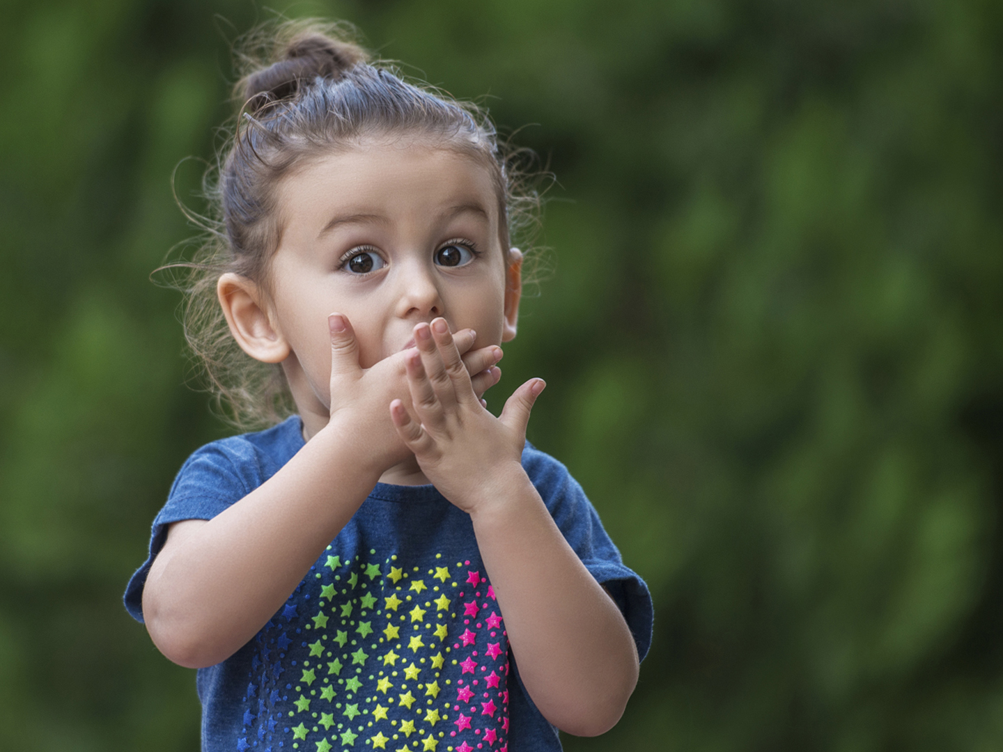 Baby girl standing with a shocked face. Image taken with NIKON D800 camera system and developed from camera RAW