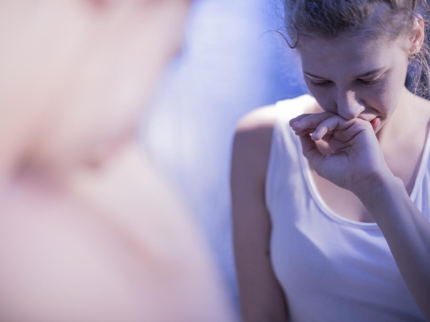 Reflection in mirror of teenage girl feeling sick