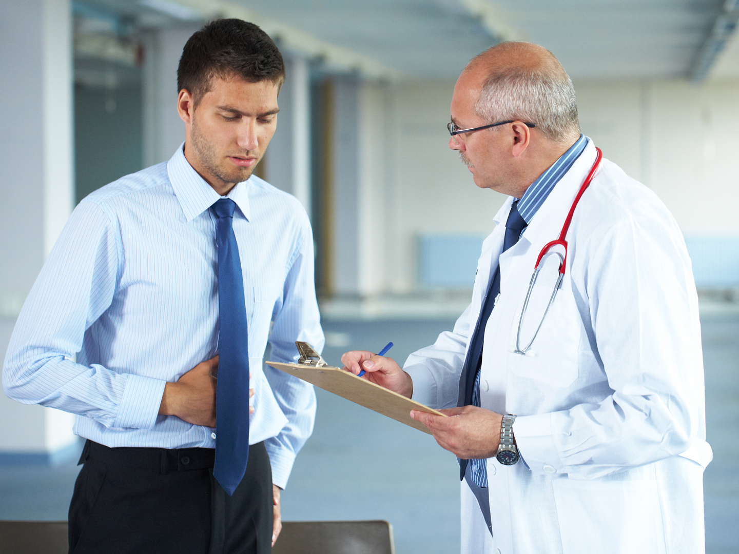 &quot;senior doctor and his patient, young male, hospital indoor shoot&quot;