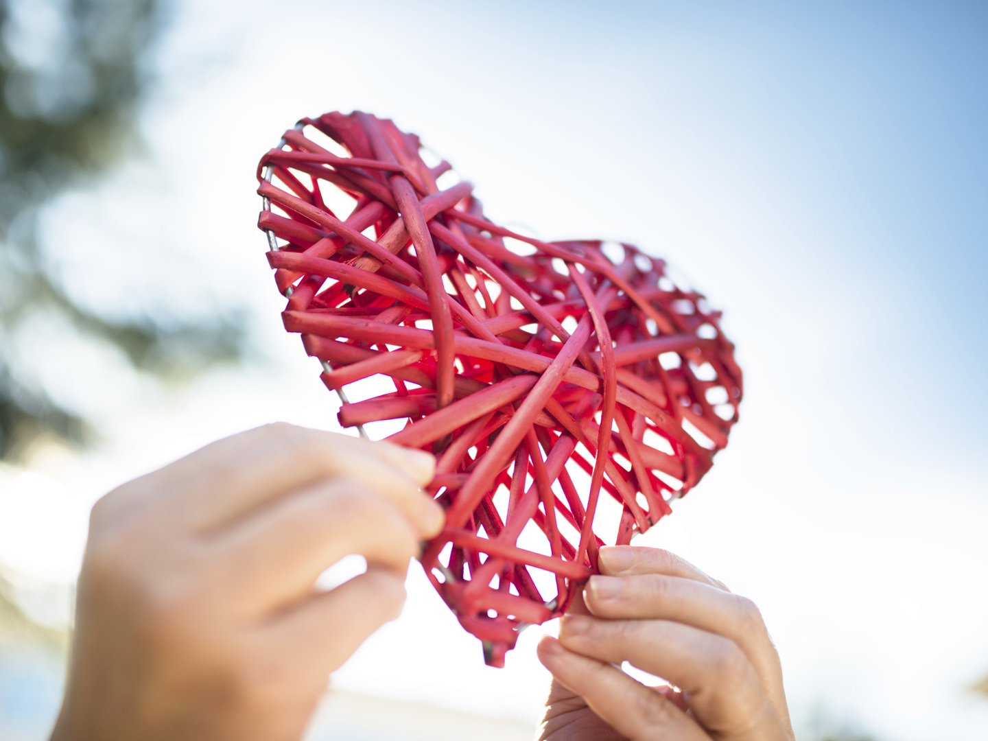 holding an wooden heart for st. valentine