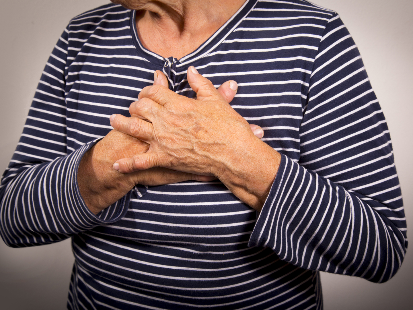 Senior woman having chest pain. Hearth attack