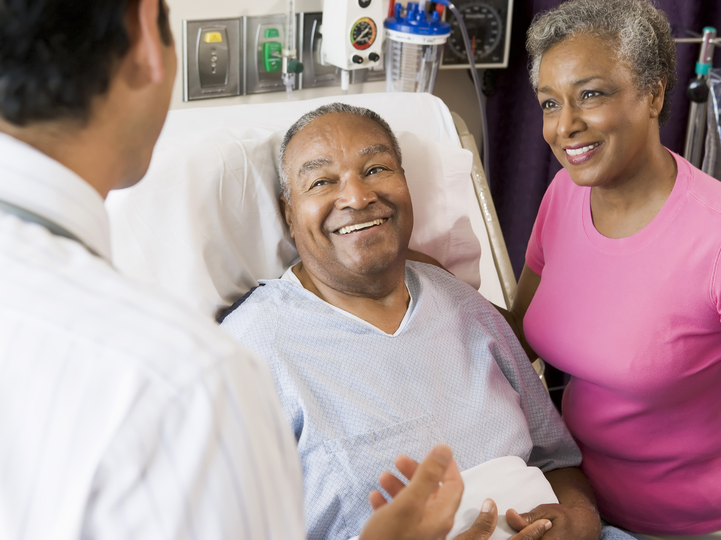 Senior Couple Talking,With Doctor smiling