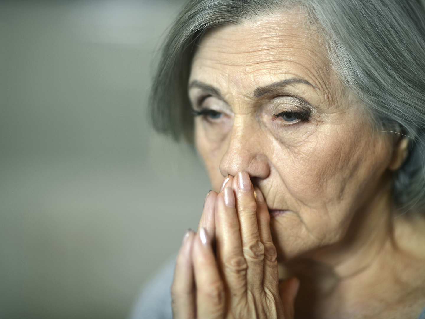 Portrait of thoughtful sad elderly woman