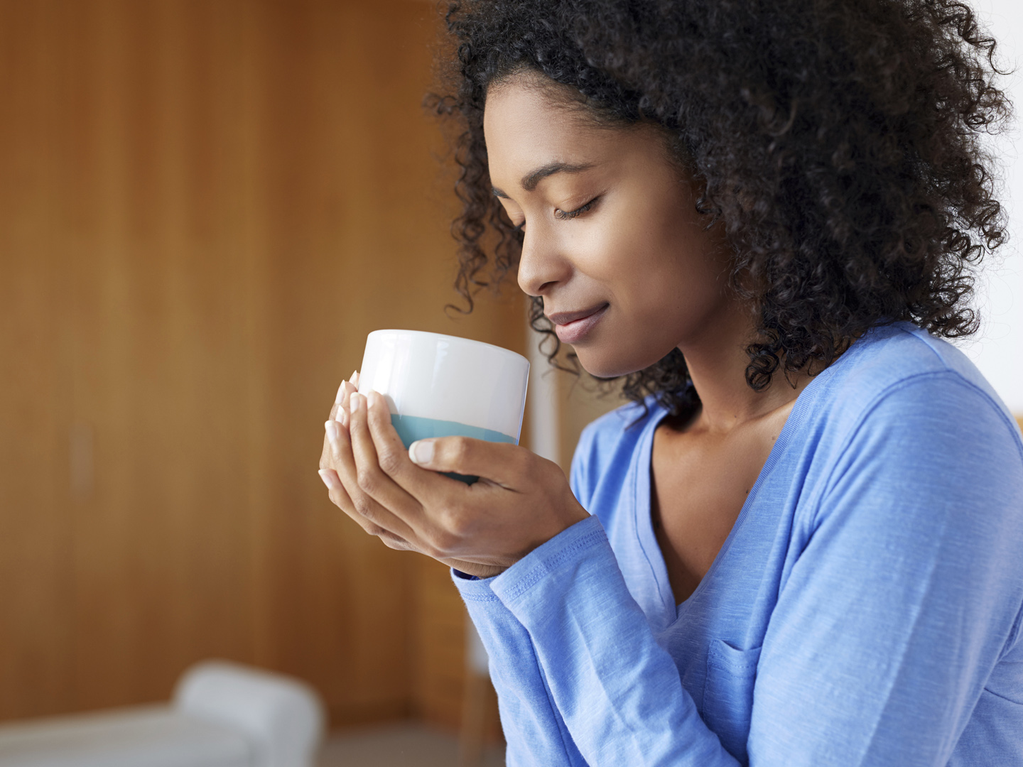 Shot of a young woman having a cup of coffee at homehttp://195.154.178.81/DATA/i_collage/pu/shoots/805717.jpg