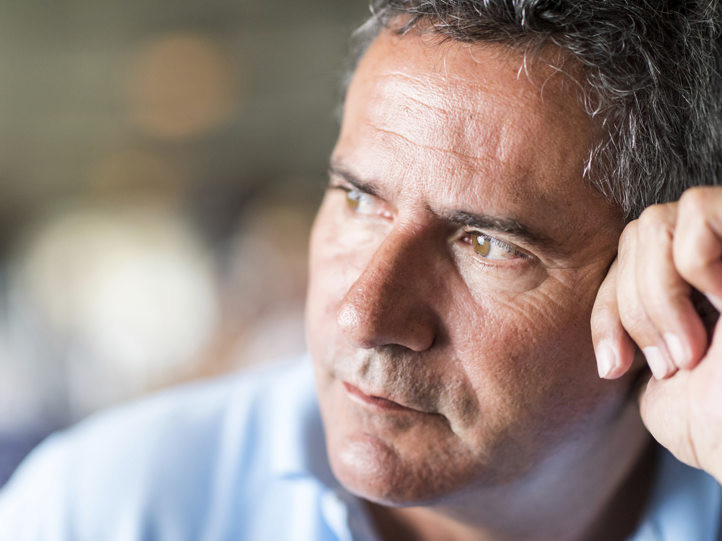 Pensive mature man looking away