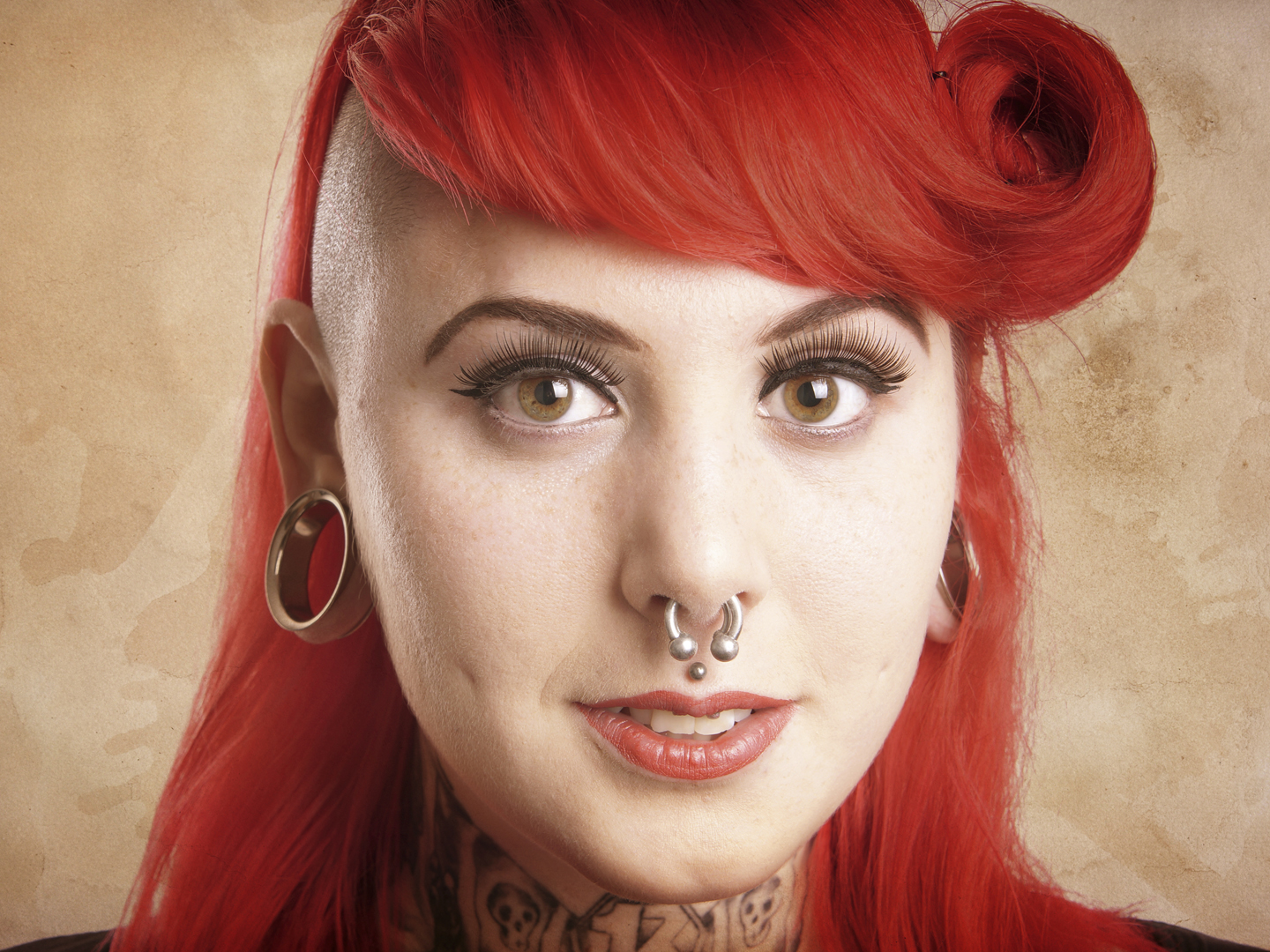 young alternative woman with side cut, facial piercings and tattoos - with added texture filter effect