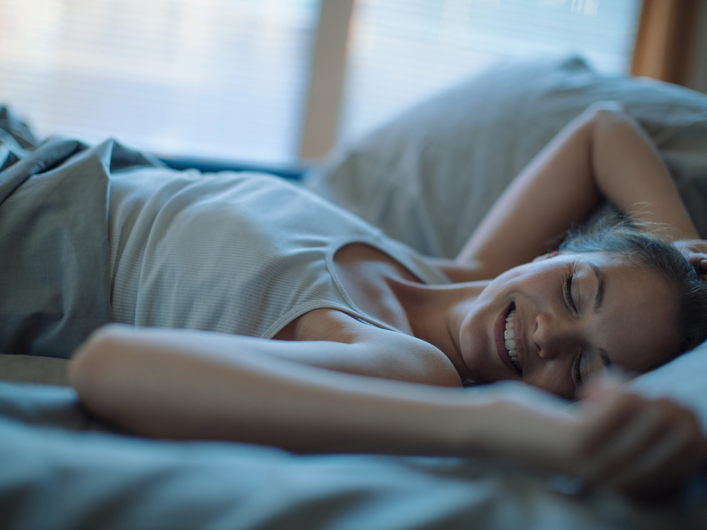 Close up of a woman sleeping on the bed