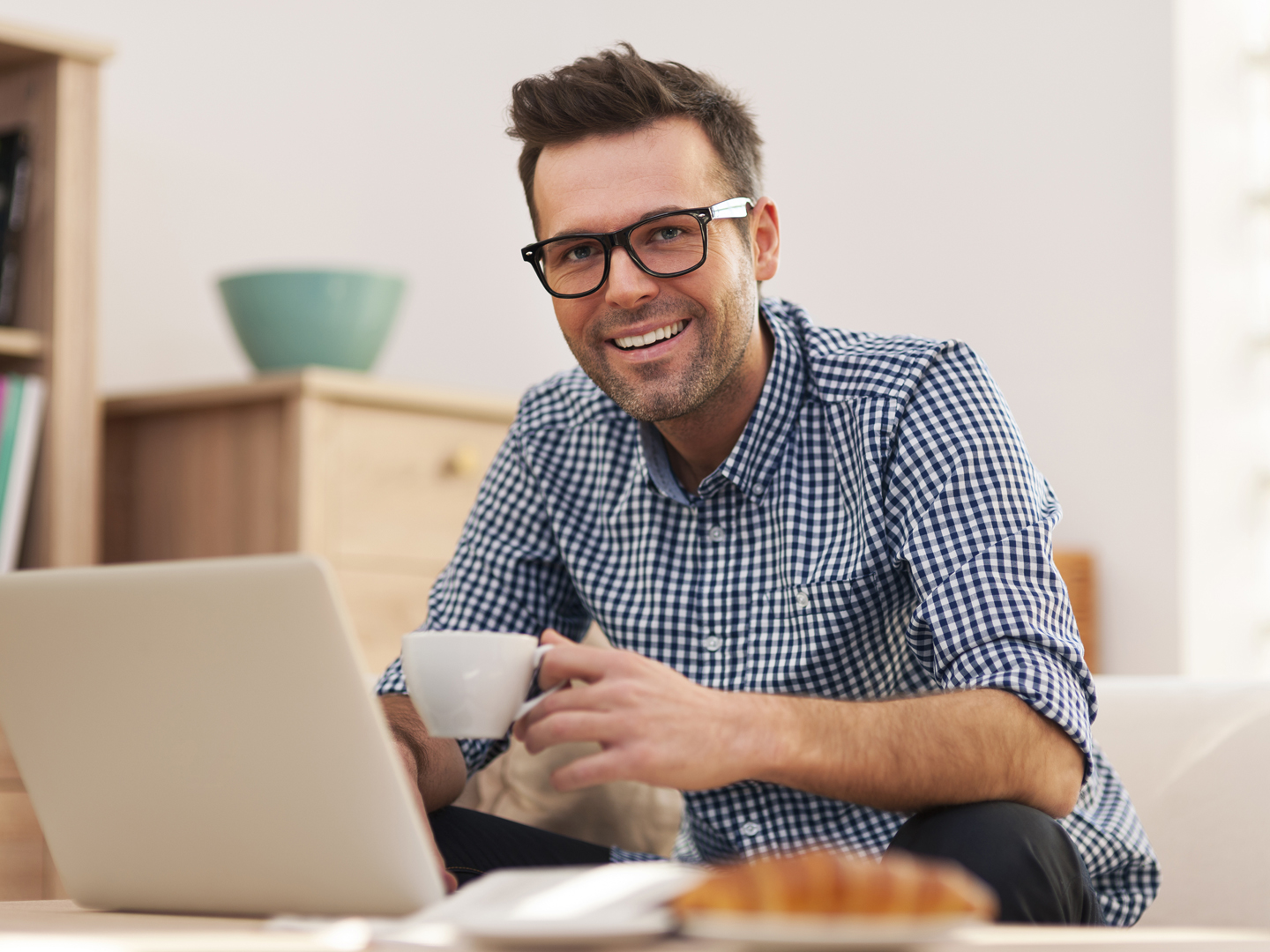 Portrait of smiling man working at home
