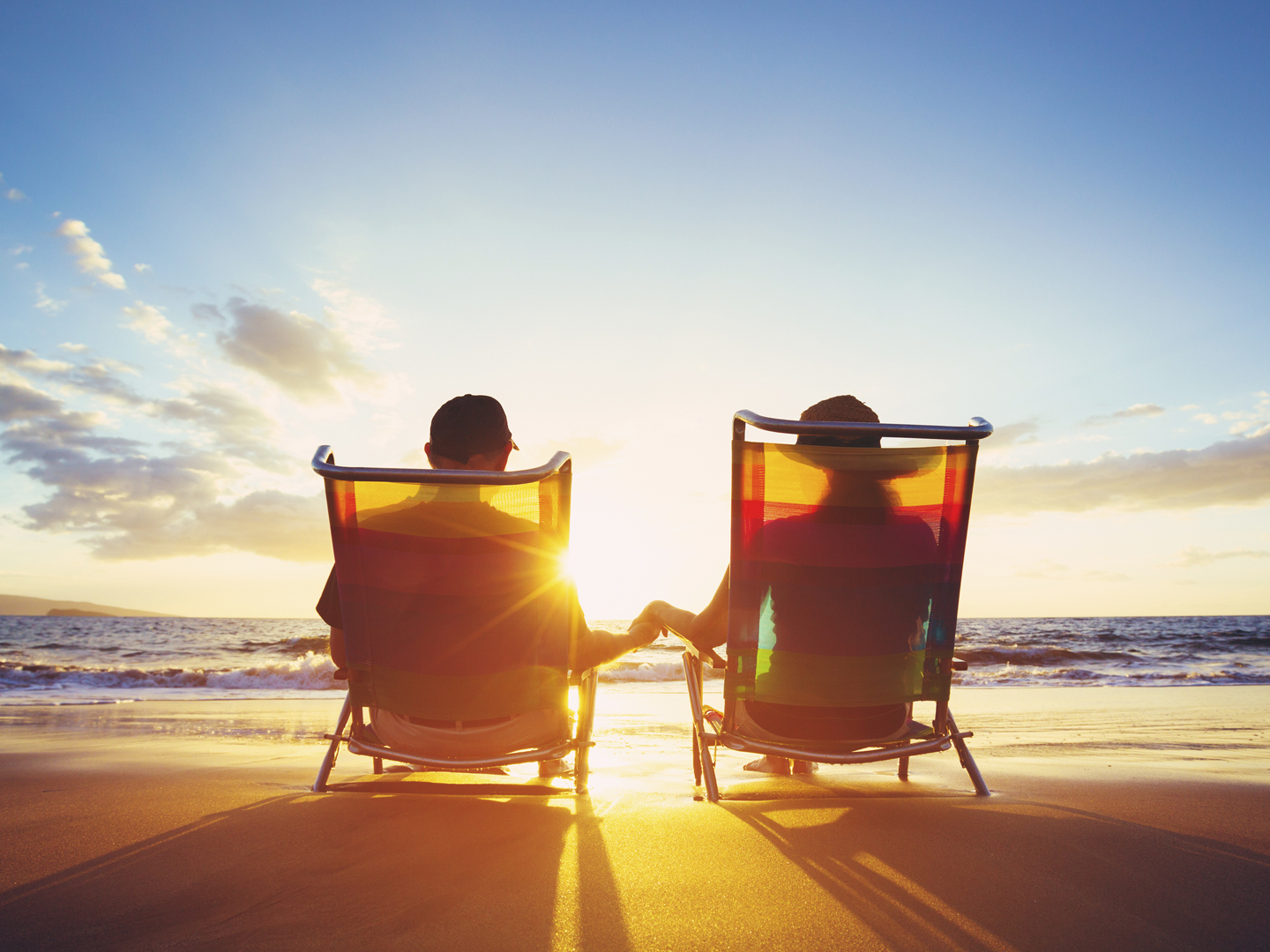 Retirement Vacation Concept, Happy Mature Retired Couple Enjoying Beautiful Sunset at the Beach