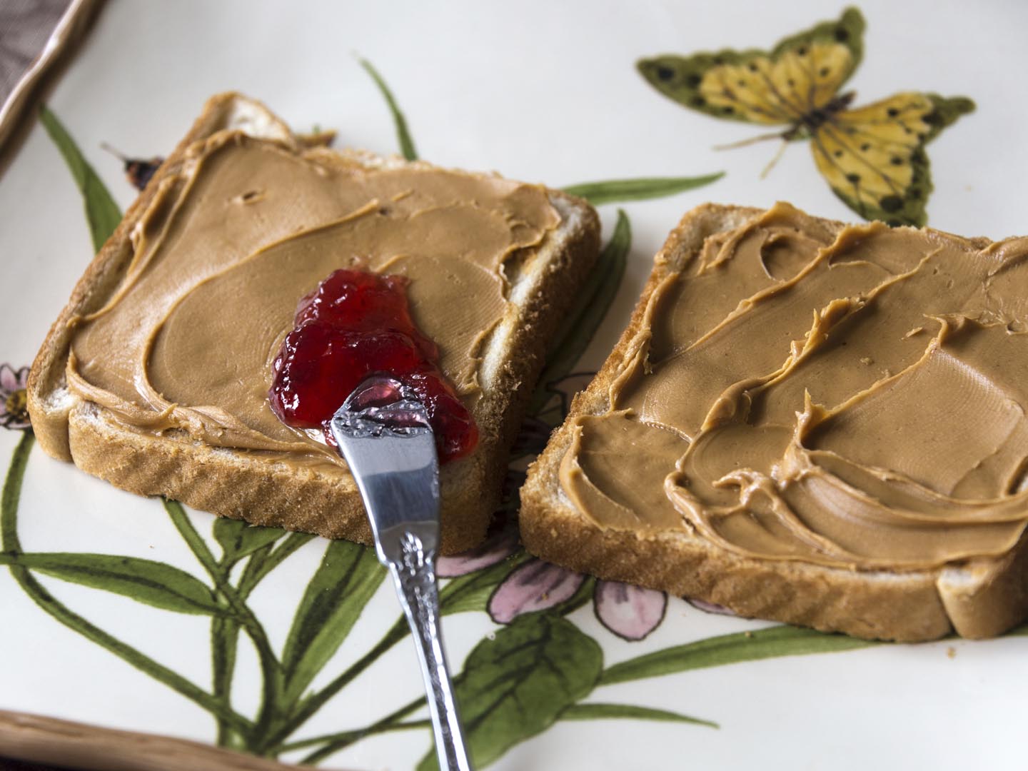 Peanutbutter bread and jelly is being made