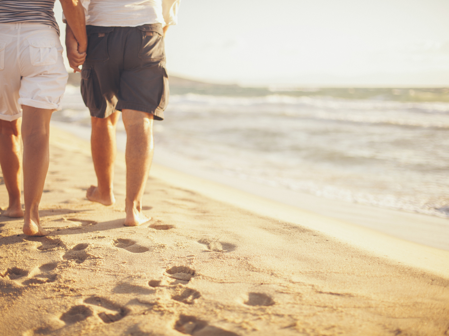 Senior couple walking on the beach