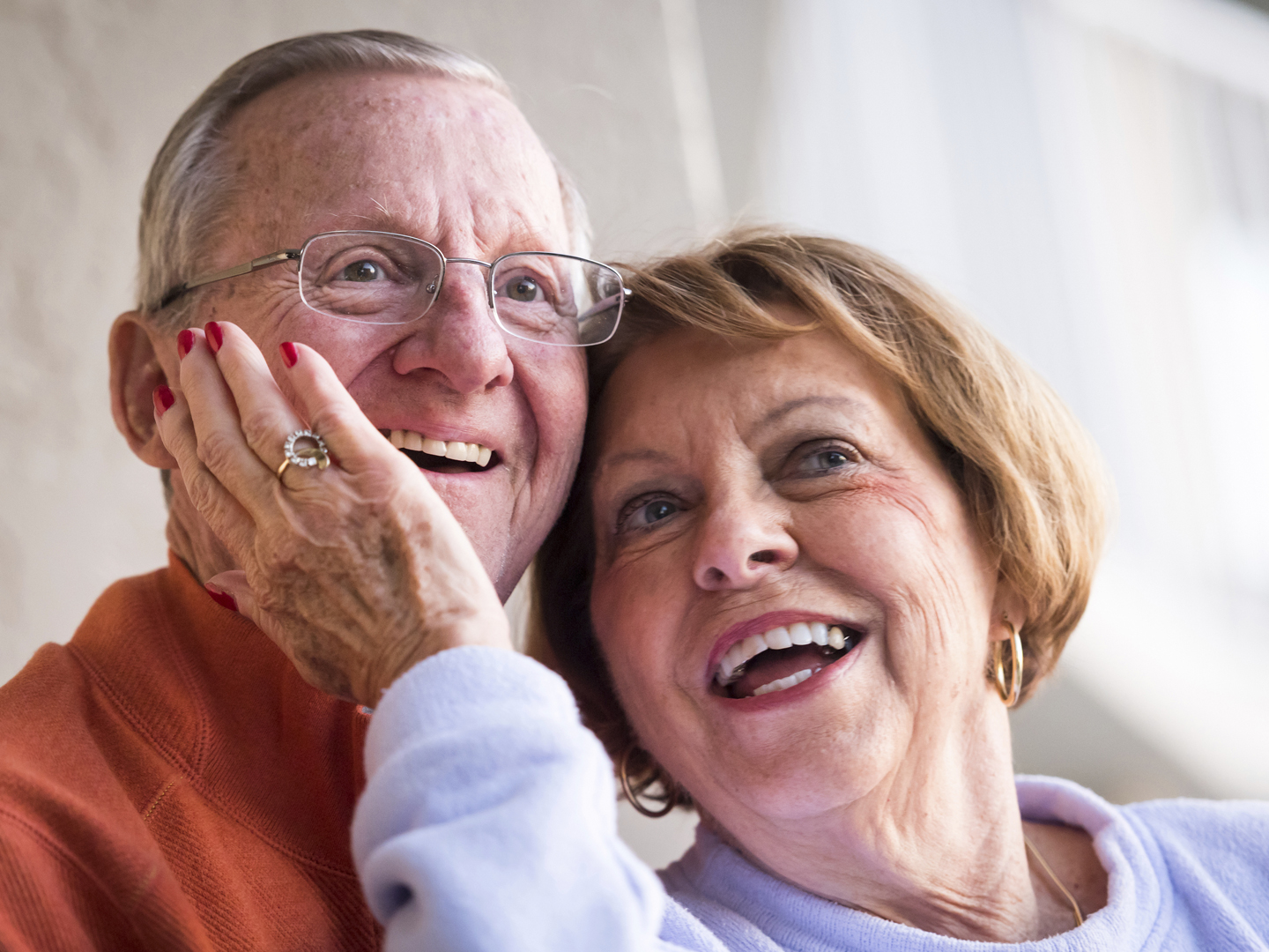 Smiling Senior Couple looking away