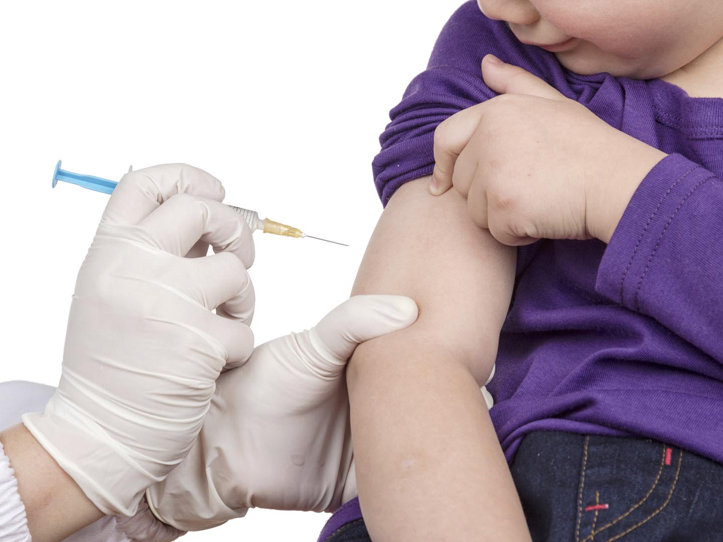 The doctor gave children vaccination needle