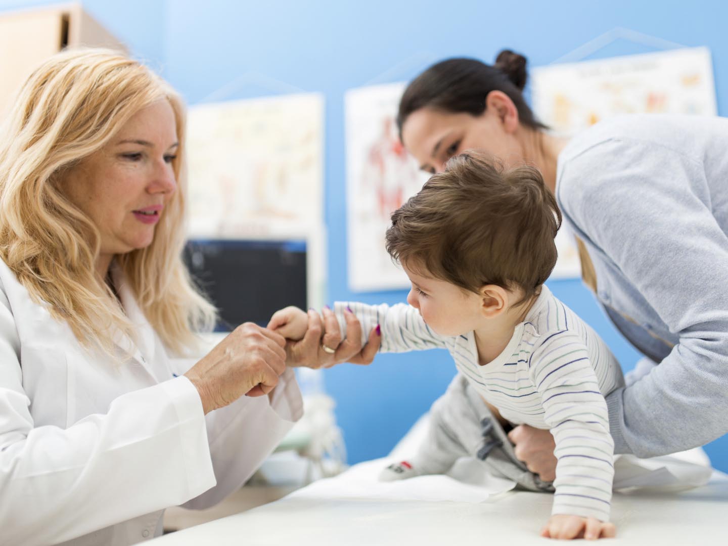 Young woman and her son at the doctor